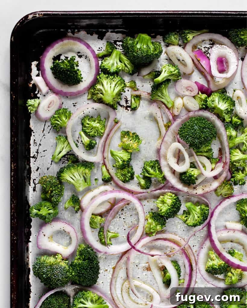 Roasted Broccoli and Caramelized Onion Egg Bites 5 Broccoli and red onions on sheet pan