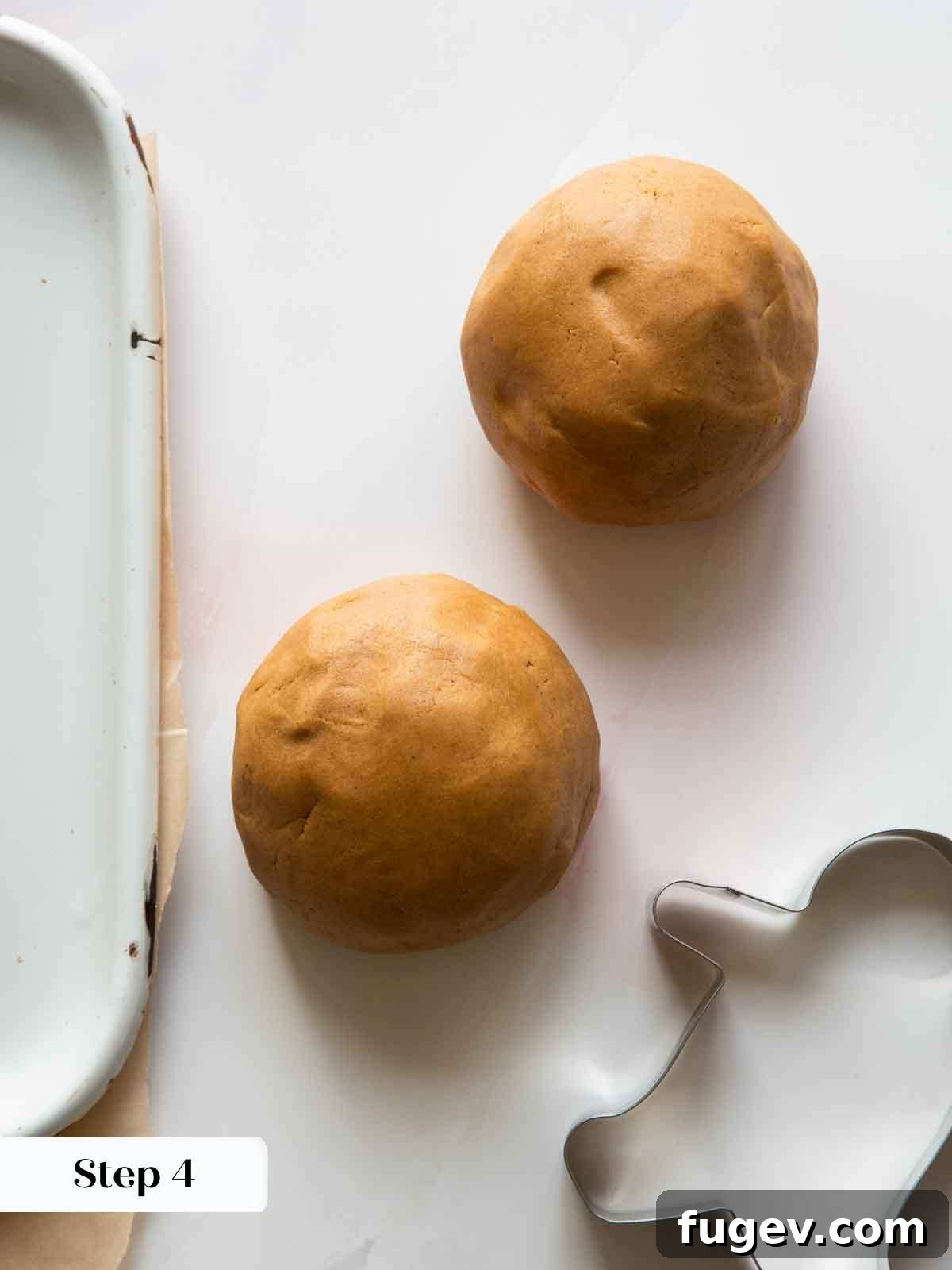 Melt-in-Your-Mouth Gingerbread Treats 6 Two mounds of prepared gingerbread dough on a countertop, ready for chilling.