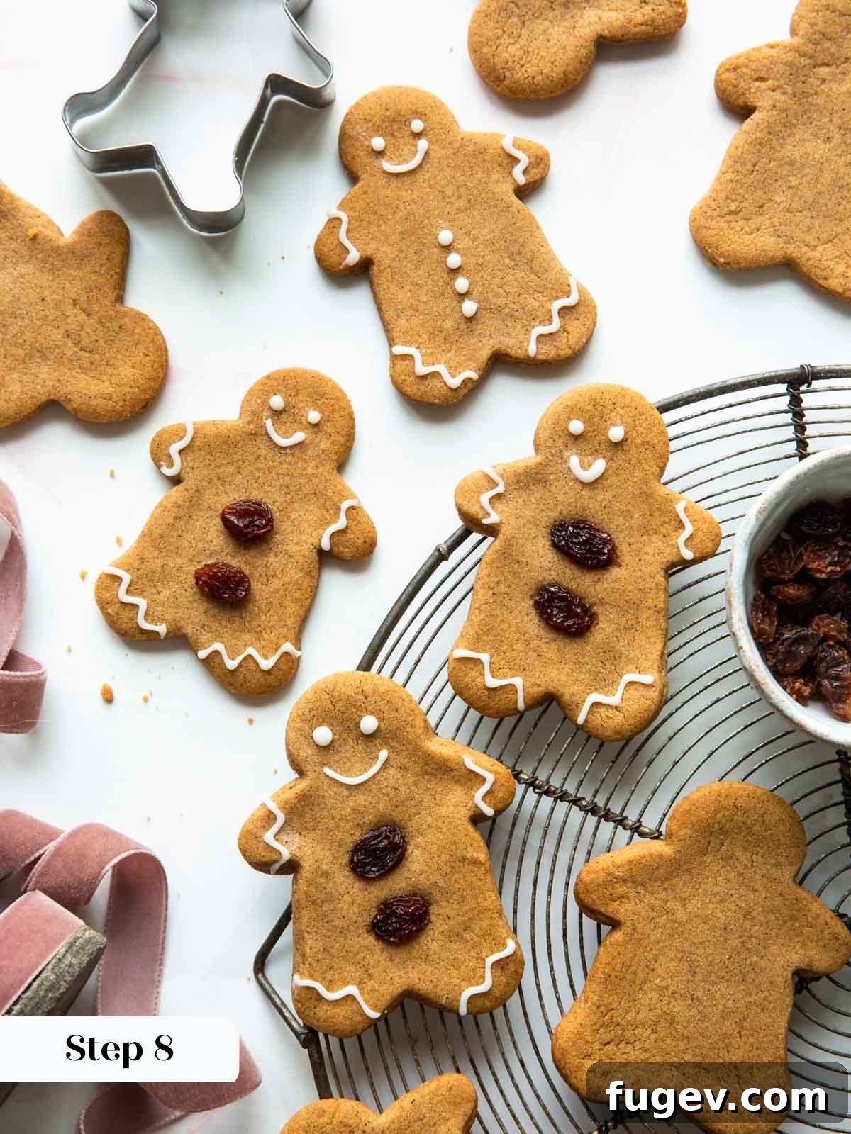 Melt-in-Your-Mouth Gingerbread Treats 9 Baked and decorated gingerbread cookies, cooling beautifully on a wire rack.