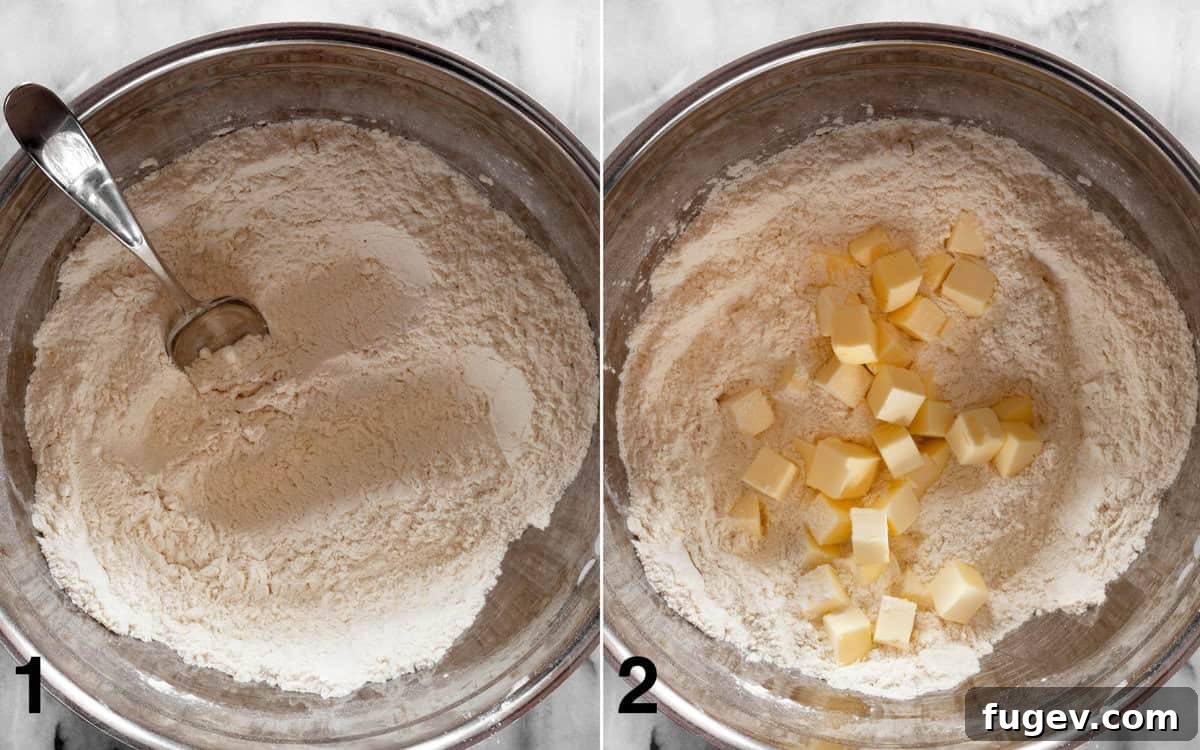 Almond-Kissed Strawberry Scones 4 A visual guide depicting the initial steps: first, dry ingredients are thoroughly mixed in a bowl, followed by cold cubed butter being cut into the flour mixture until coarse crumbs are formed.