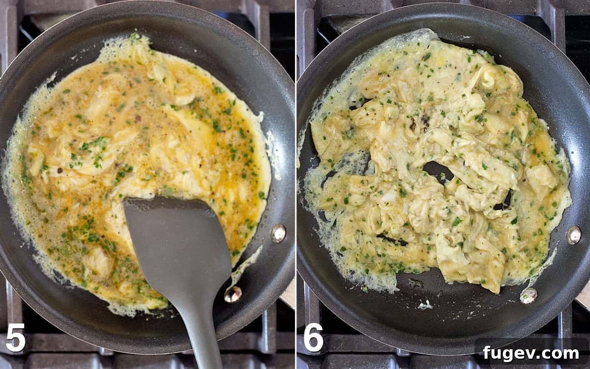 Golden Pesto Eggs with Blistered Tomatoes 5 Eggs cooking in a skillet.