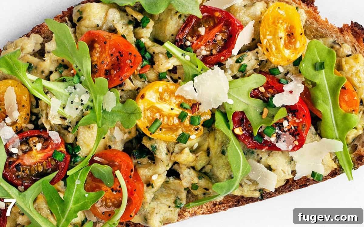 Golden Pesto Eggs with Blistered Tomatoes 6 Assembled pesto eggs with roasted tomatoes on toast.