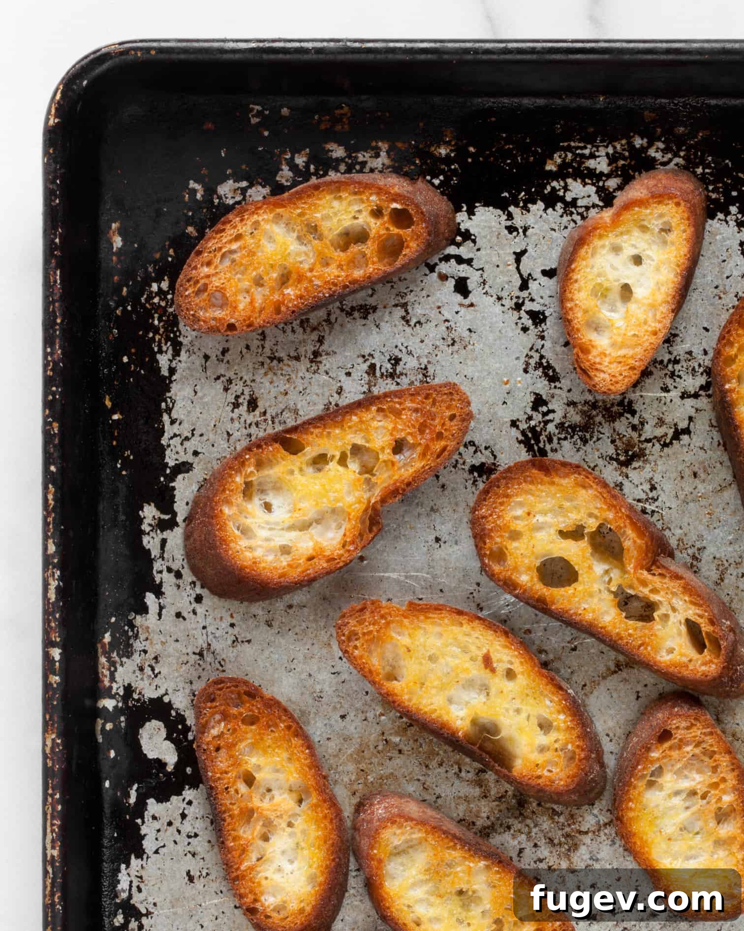 Sun-Kissed Tomato Burrata 7 Toasted bread on a sheet pan
