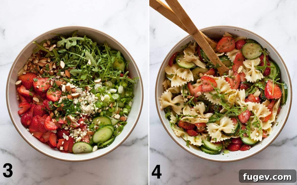 Strawberry Cucumber Pasta Medley 5 Pasta salad ingredients in a bowl. Pasta salad stirred together.