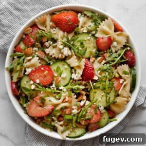 Strawberry Cucumber Pasta Medley 6 Easy pasta salad with strawberries and cucumbers in a bowl.