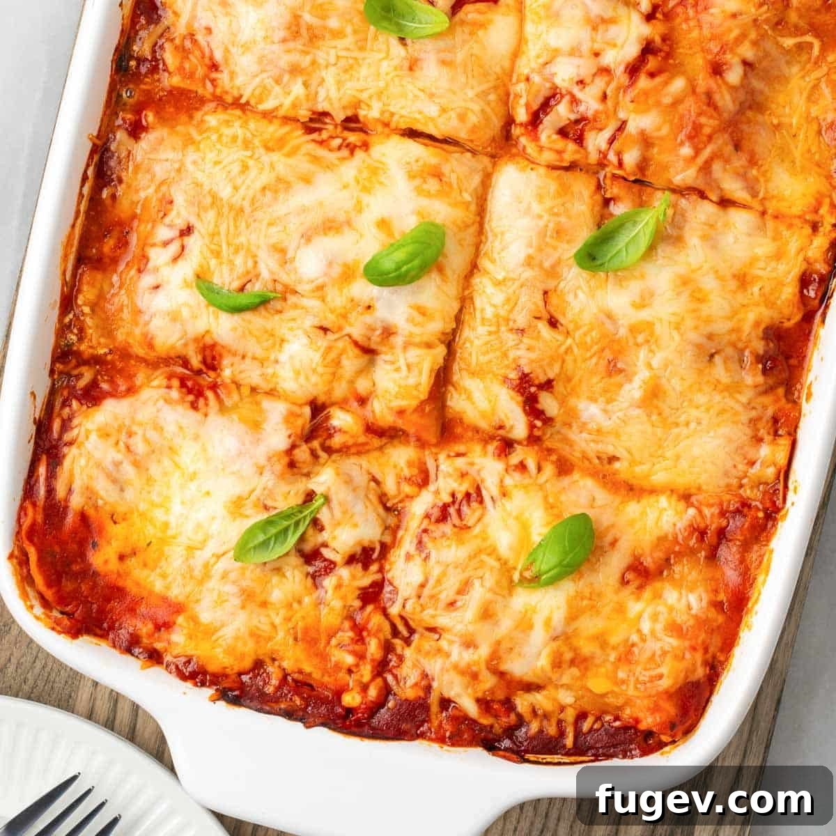 Vibrant Veggie Lasagna 3 A freshly baked vegetable lasagna, perfectly sliced and showing its beautiful layers of golden cheese, pasta, and vibrant vegetables.