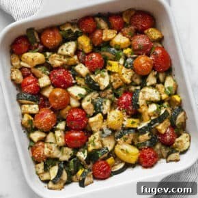 Colorful balsamic zucchini tomato bake in a casserole dish, ready to serve.