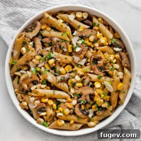 Mushroom corn penne in a bowl.