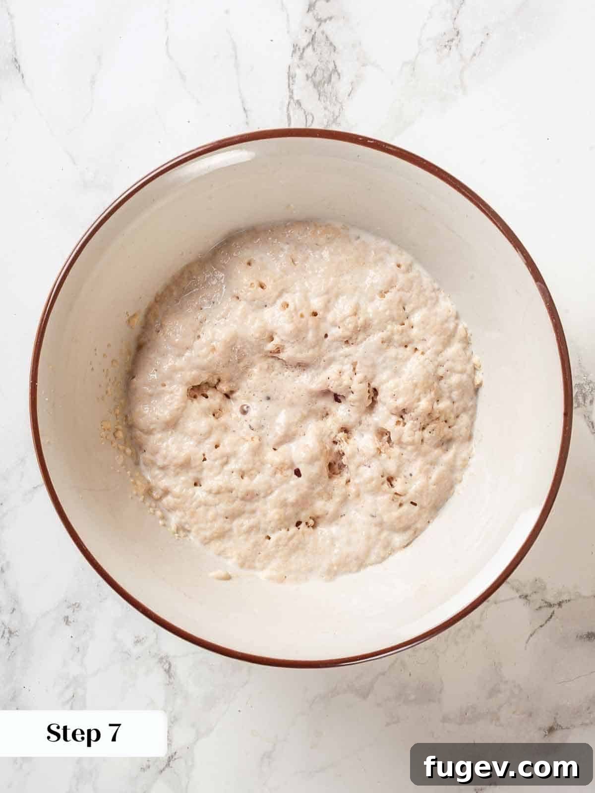 Pillowy Potato Loaf 6 A small bowl of bloomed yeast, foamy and active for bread making.