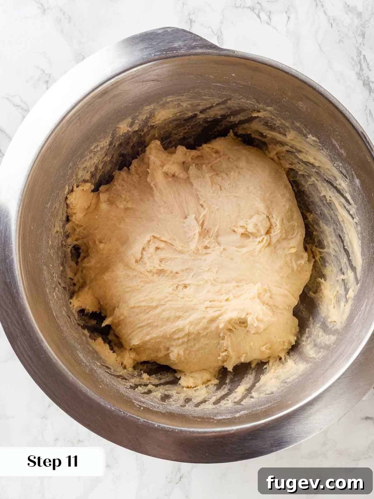 Pillowy Potato Loaf 9 Flour and sugar added to a mixing bowl with wet ingredients for potato bread.