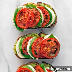 Fresh Caprese Avocado Toast 6 Two vibrant slices of Caprese Avocado Toast, garnished with fresh basil.