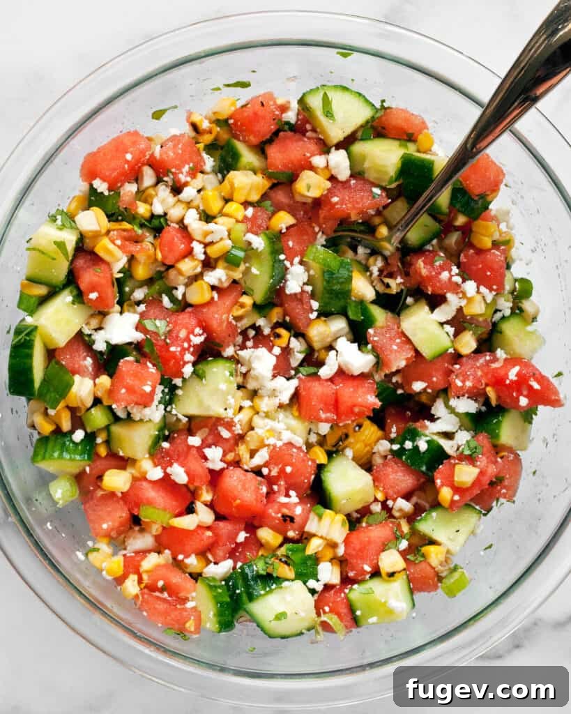 Vibrant Watermelon Cucumber Corn Medley 6 Combining the ingredients for Watermelon Cucumber Corn Salad