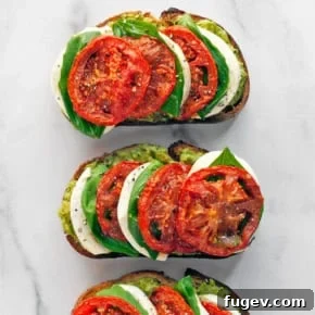 Two slices of caprese avocado toast.