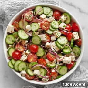 Cucumber tomato feta salad in a bowl.
