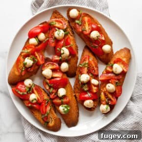 Caprese bruschetta on a plate.