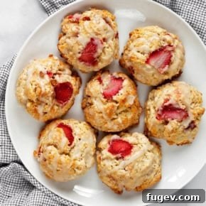 Strawberry almond scones on a plate.