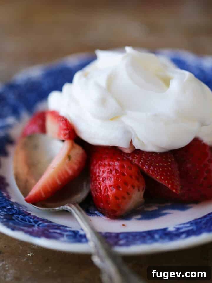 Zesty Cloud Cream 4 Close-up of Lemon Whipped Cream with fresh strawberries, highlighting its creamy texture