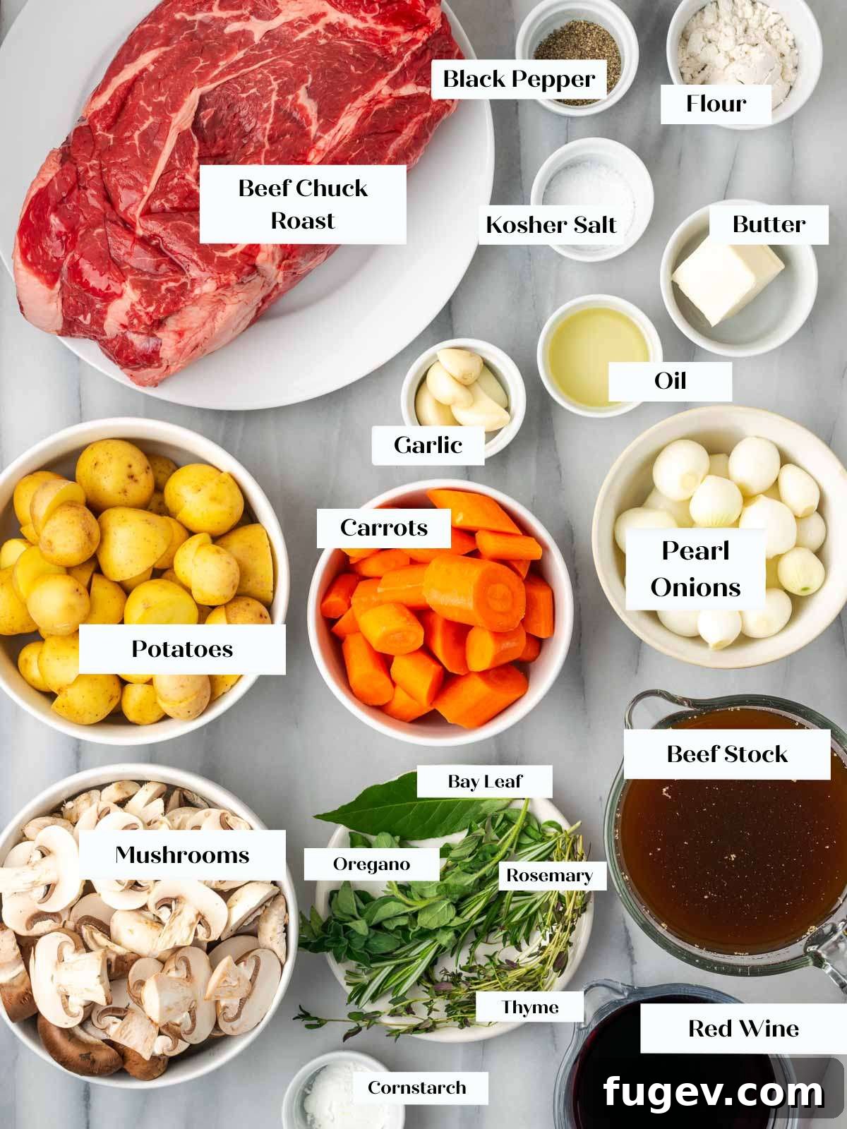 Fresh Ingredients for Pot Roast Assortment of fresh ingredients for pot roast, including beef, vegetables, and herbs on white marble.