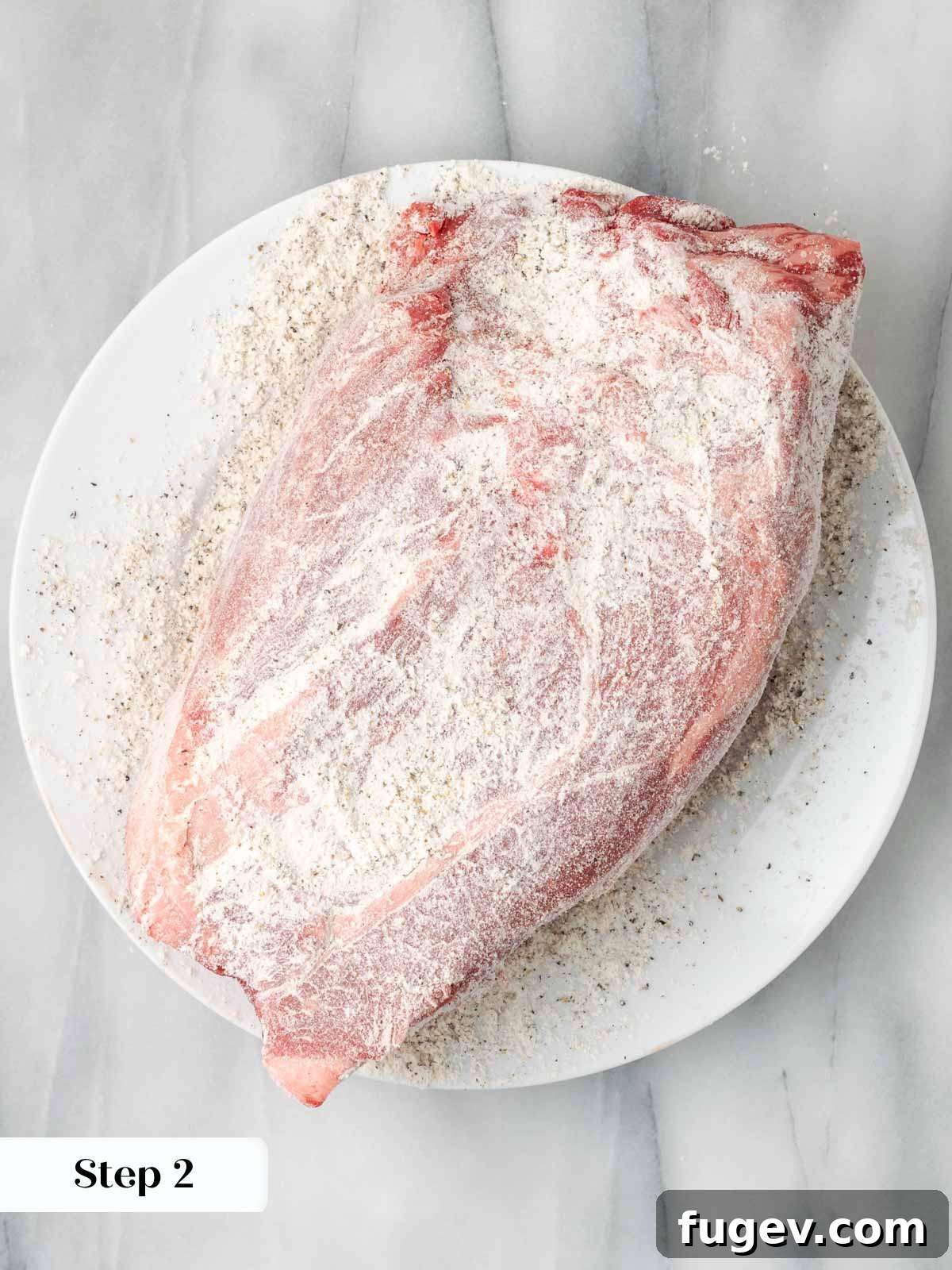 Seasoned Roast Ready for Searing Beef roast coated in flour, salt, and pepper, ready for searing.