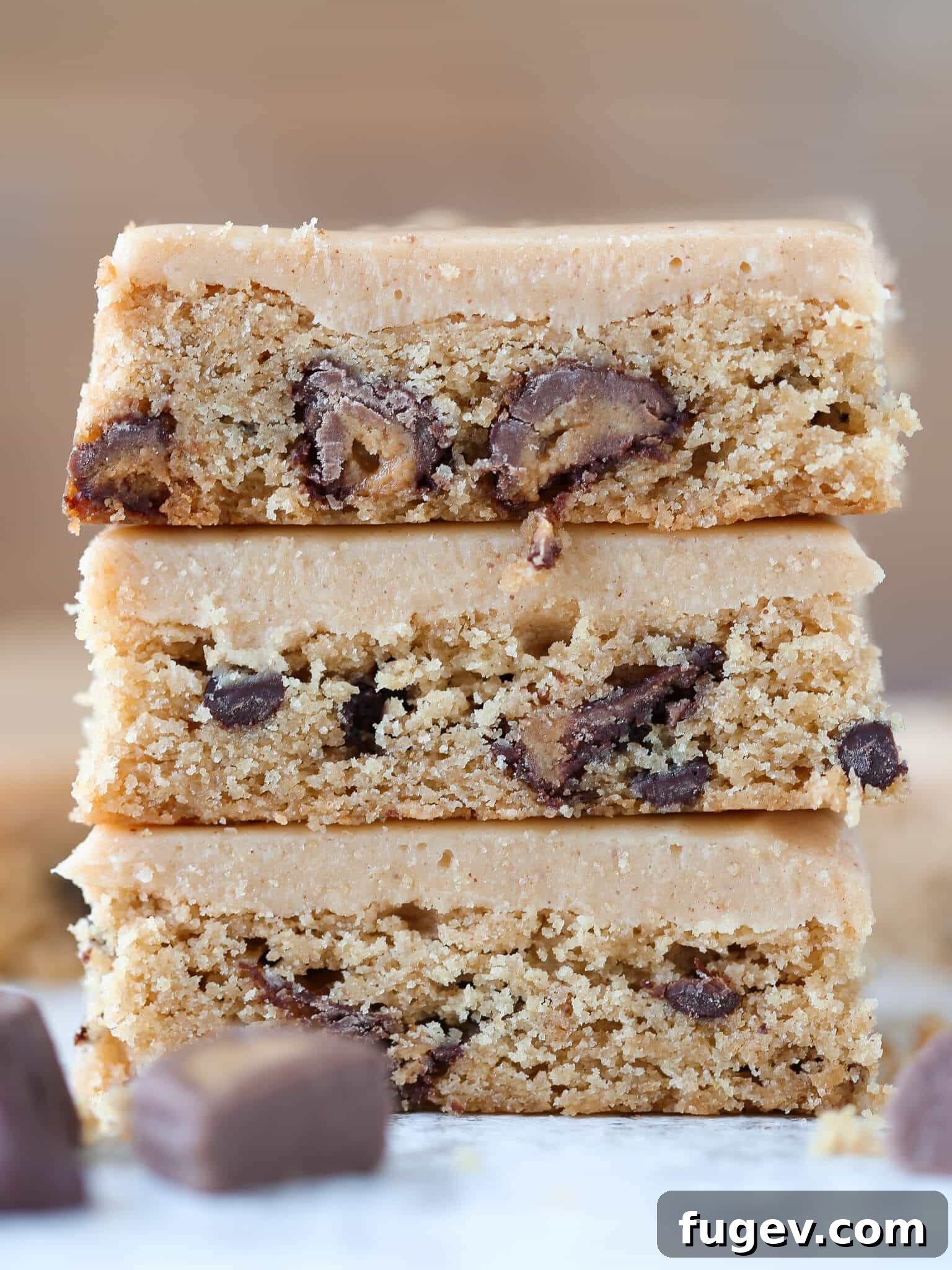 Peanut Butter Chocolate Swirl Blondies 6 Reeses Peanut Butter Blondies in a tall stack, generously covered with thick peanut butter frosting.