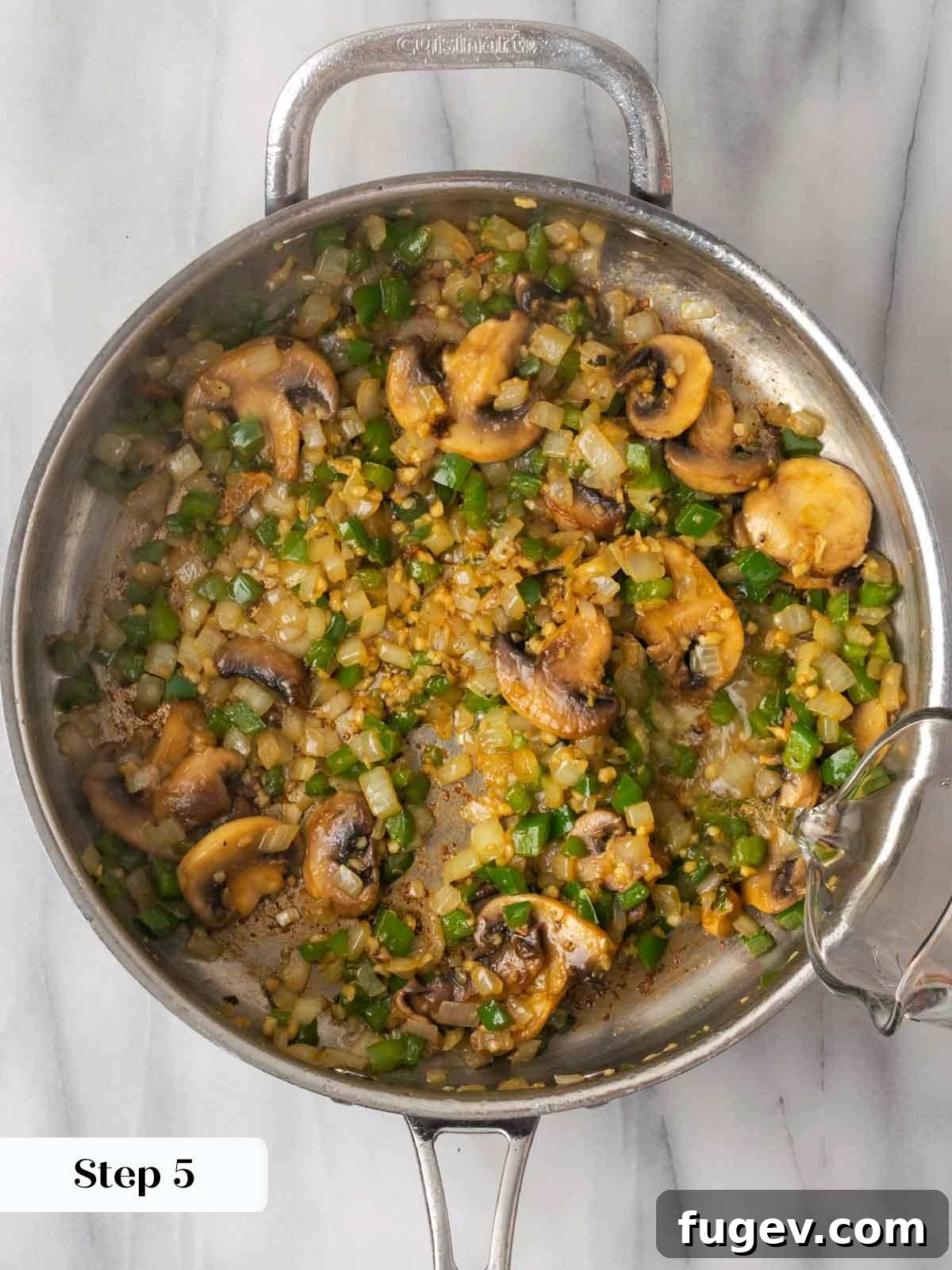 Hearty Marinara Chicken Bake 8 sautéed vegetables with white wine being poured into the pan.