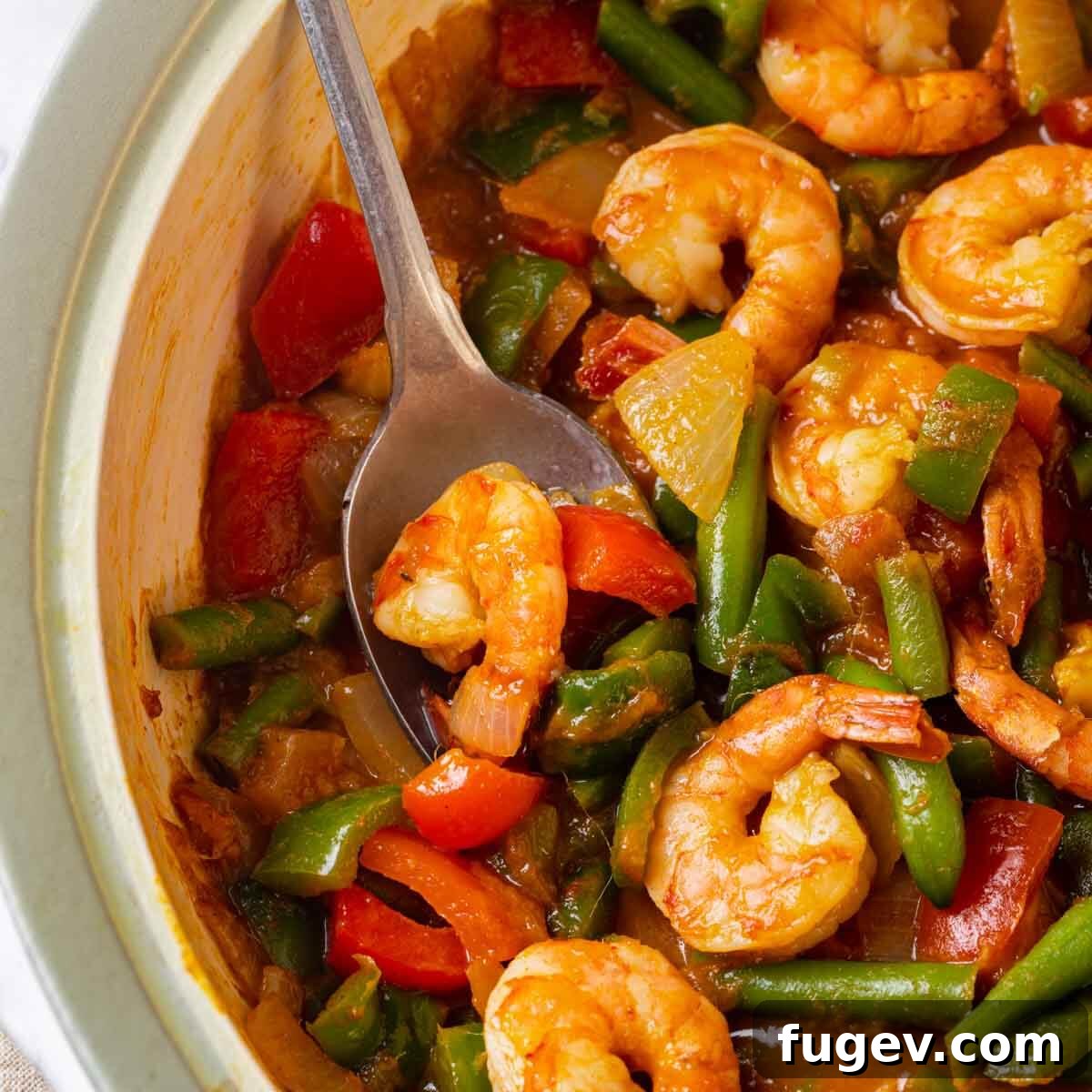 Aromatic Golden Prawns 3 Close-up of succulent cooked shrimp nestled within a rich, aromatic curry sauce, showcasing vibrant colors and enticing textures.