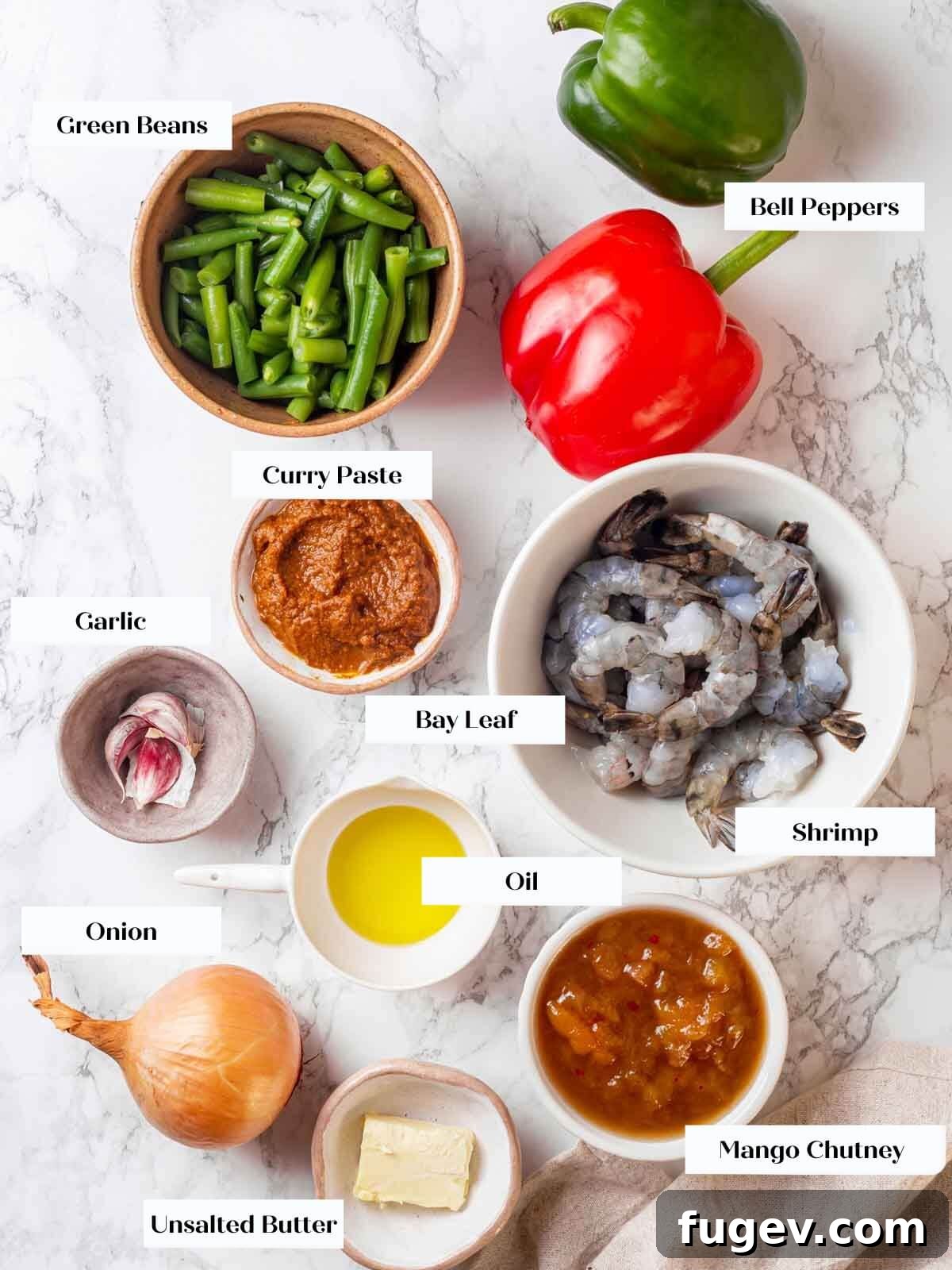 Aromatic Golden Prawns 4 A collection of fresh vegetables and curry paste, key ingredients for the flavorful shrimp curry sauce.