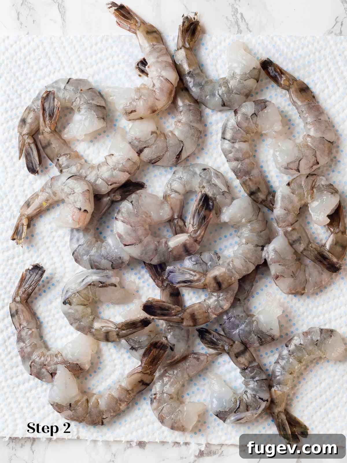 Aromatic Golden Prawns 7 Raw, deveined shrimp laid out, perfectly prepped and ready to be added to the fragrant curry.
