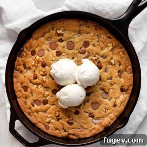 Chocolate Chip Walnut Skillet Cookie topped with ice cream
