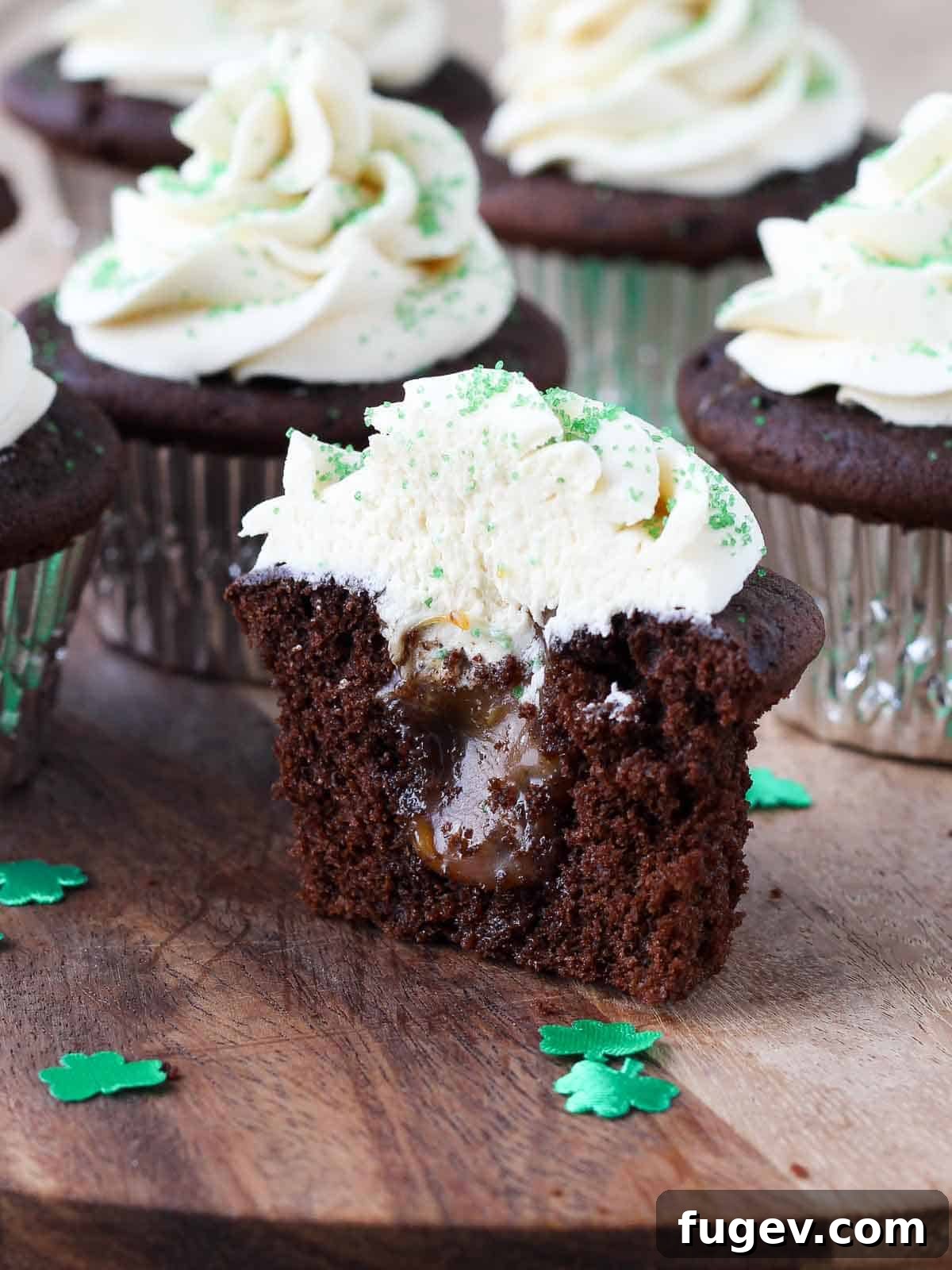 Luck of the Irish Cupcakes 11 A delicious St. Patrick's Day cupcake, cut in half, revealing the rich Guinness chocolate cake with salted caramel oozing from its core, topped with creamy Baileys buttercream.