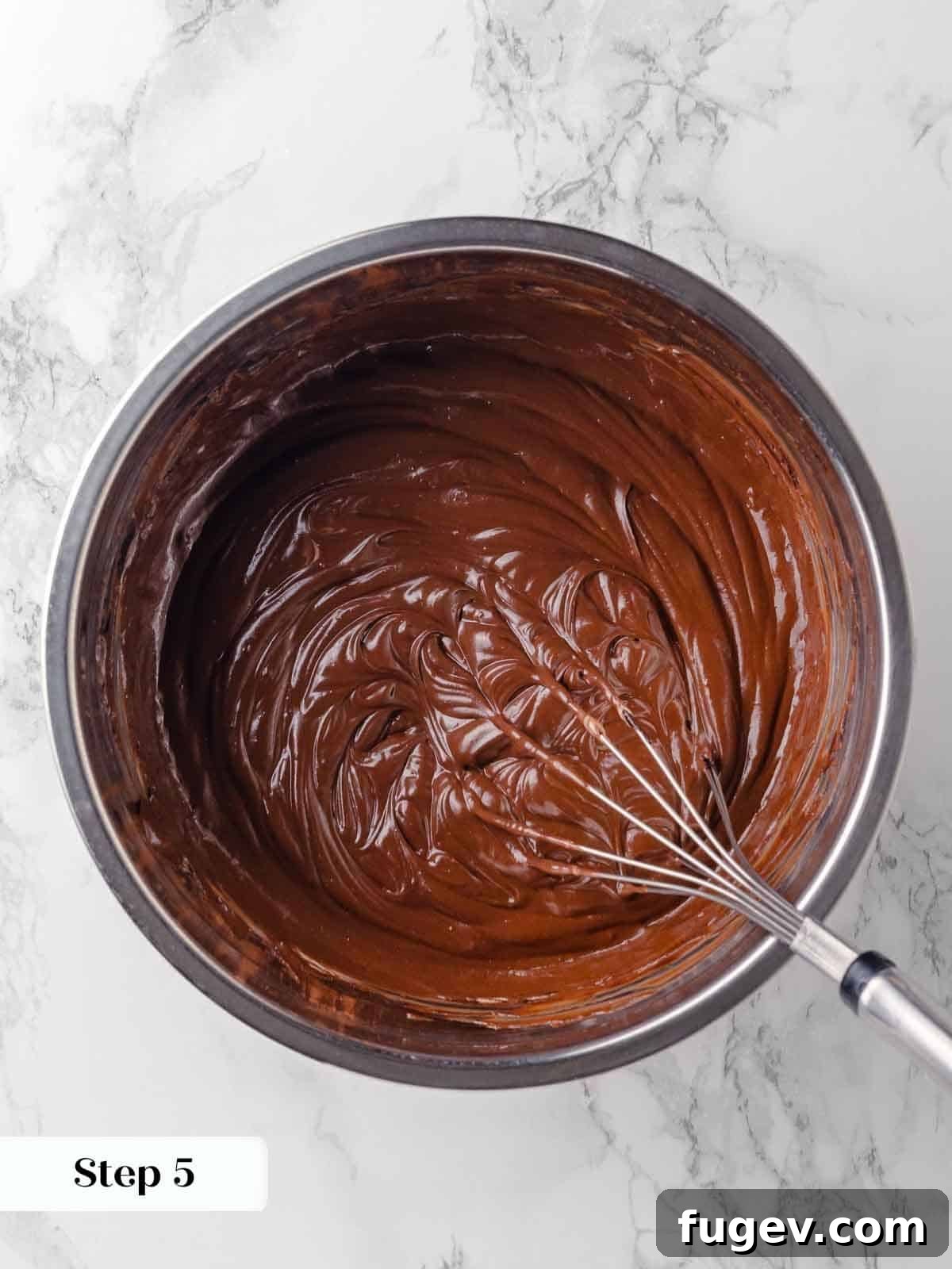 Luck of the Irish Cupcakes 7 Sour cream has been thoroughly whisked into the melted chocolate and Guinness mixture, resulting in a smooth, creamy, and dark base for the cupcakes.