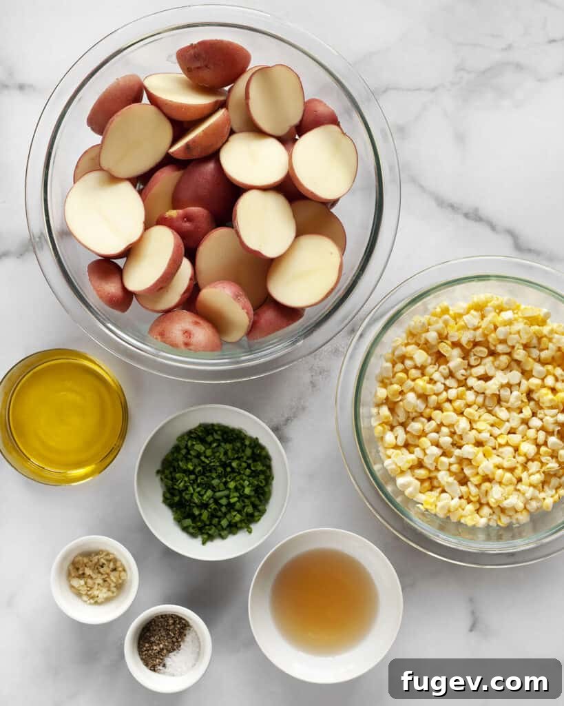 Rustic Roasted Red Potato Salad 3 Ingredients including red potatoes, corn, chives, olive oil, garlic, vinegar, salt and pepper.