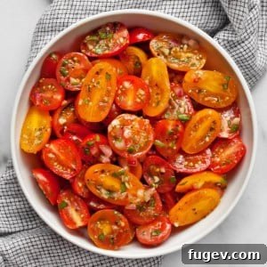 Marinated tomatoes in a bowl, ready to be served.