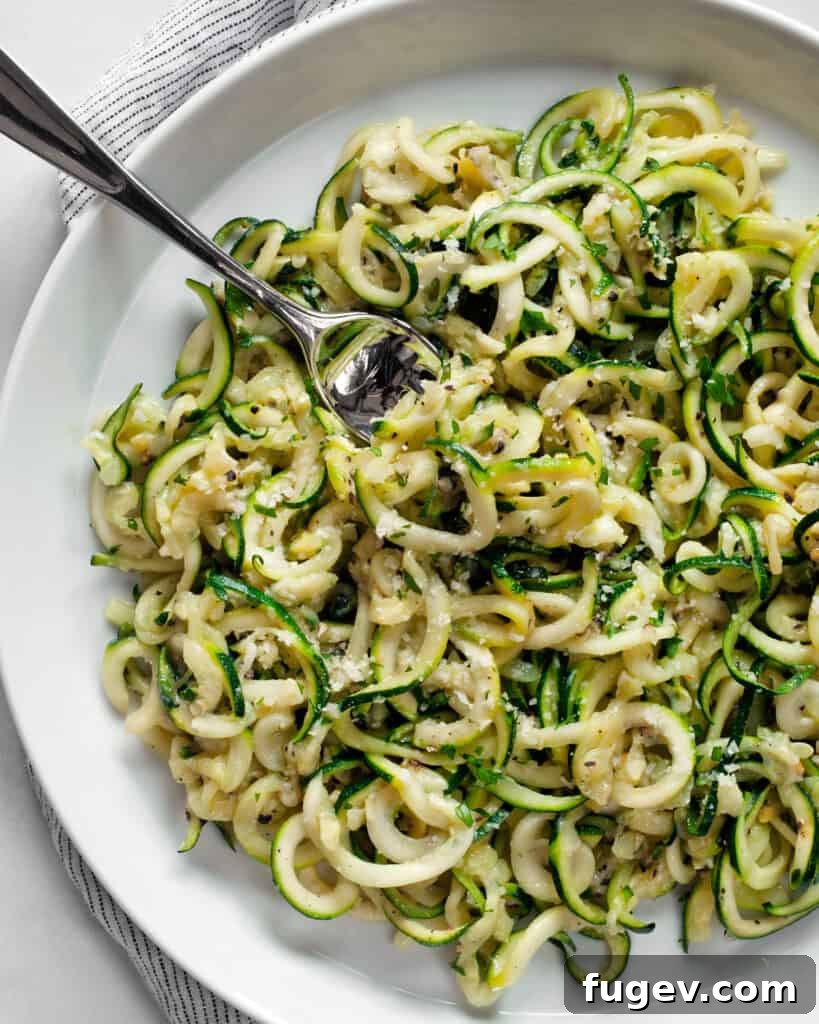 Fresh Zucchini Cacio e Pepe 2 Freshly cooked Zucchini Cacio e Pepe in a bowl, garnished with extra pepper and cheese.