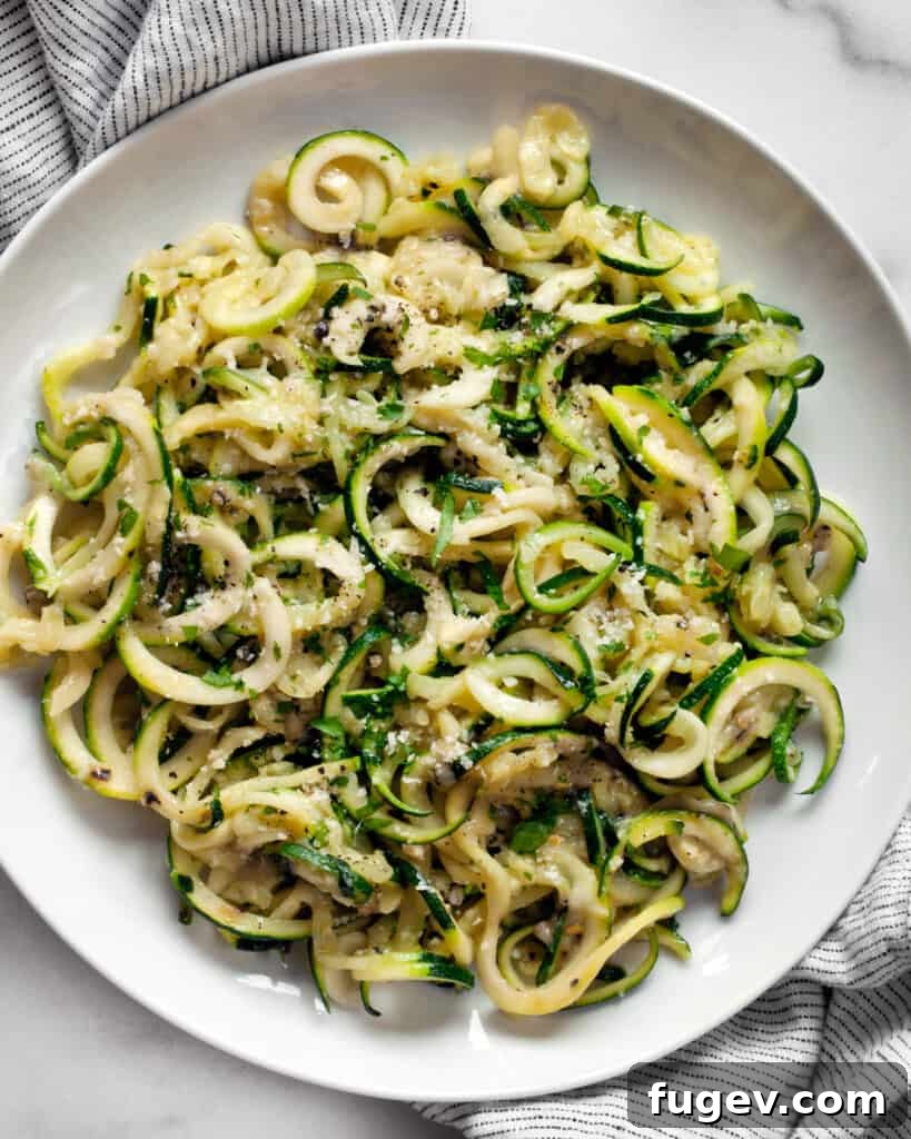 Fresh Zucchini Cacio e Pepe 4 Bowl of Cacio e Pepe pasta made with zucchini noodles, ready to be served.