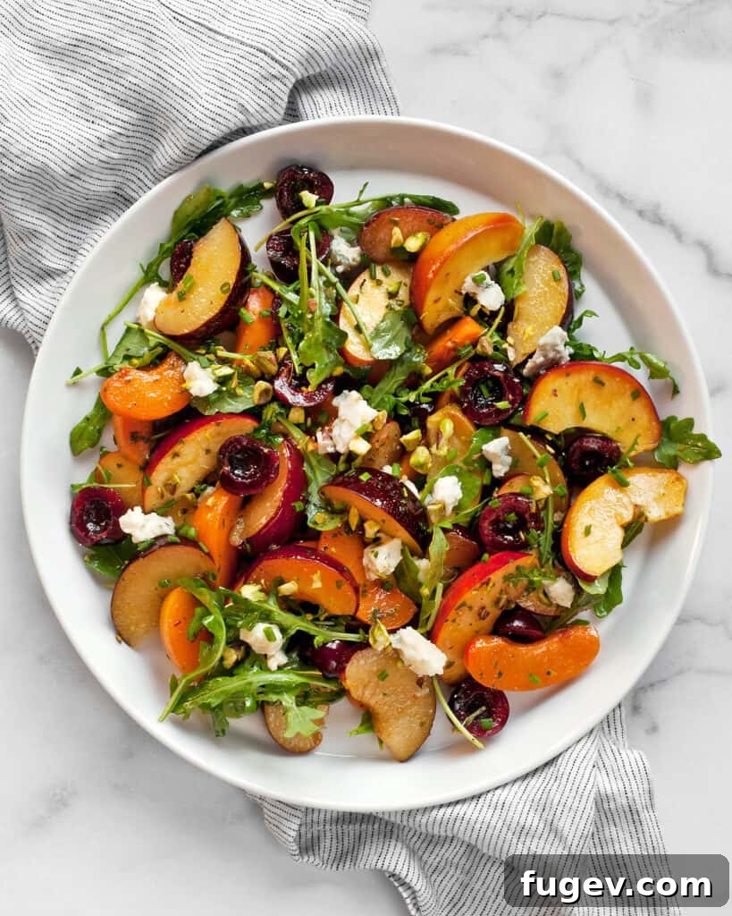 Summer Stone Fruit Salad with Creamy Gorgonzola and Zesty Pesto Vinaigrette 3 Close-up of fresh stone fruits and assorted ingredients ready for salad preparation