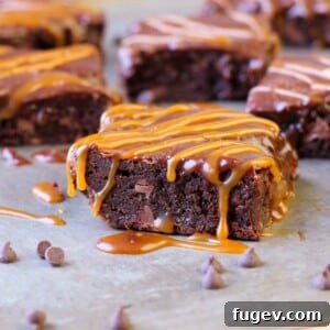 Close-up of a square salted caramel brownie with Baileys ganache