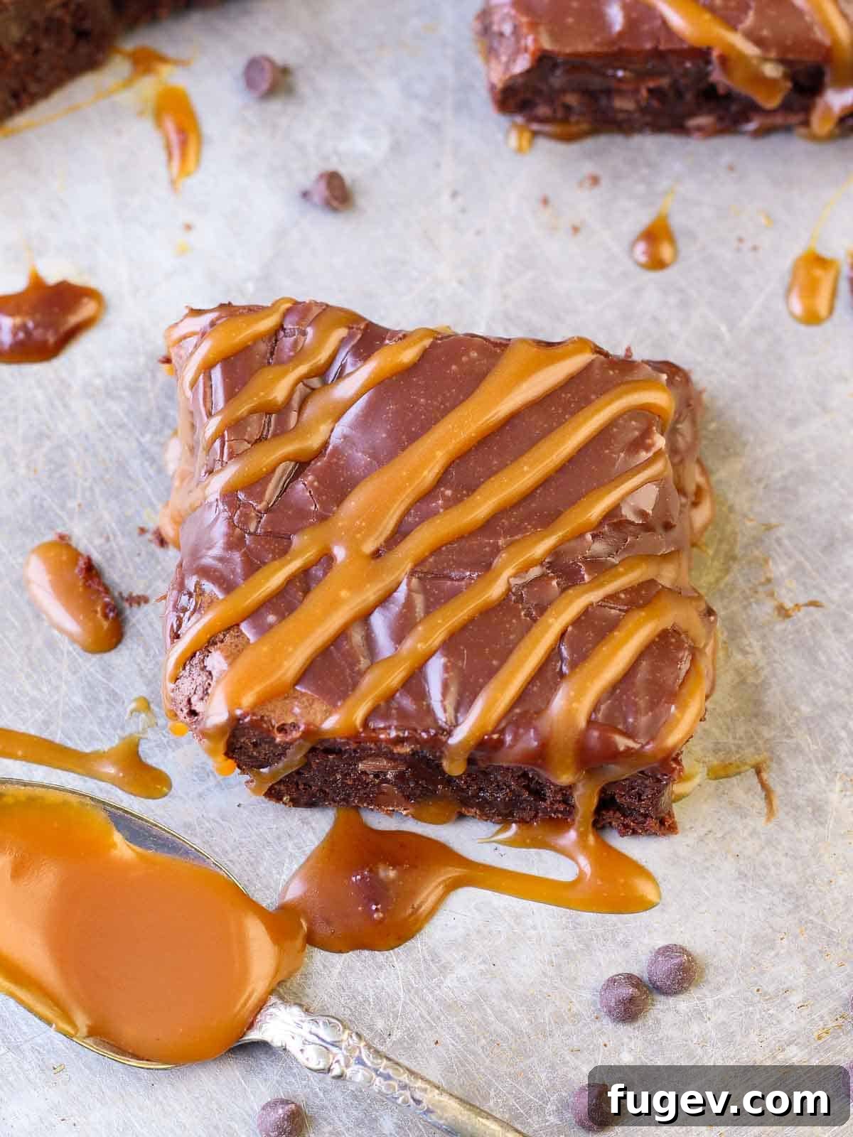 Decadent Caramel Brownie 5 Sliced fudgy caramel brownies topped with smooth Baileys Irish coffee ganache and a drizzle of extra caramel, beautifully presented and ready to serve.