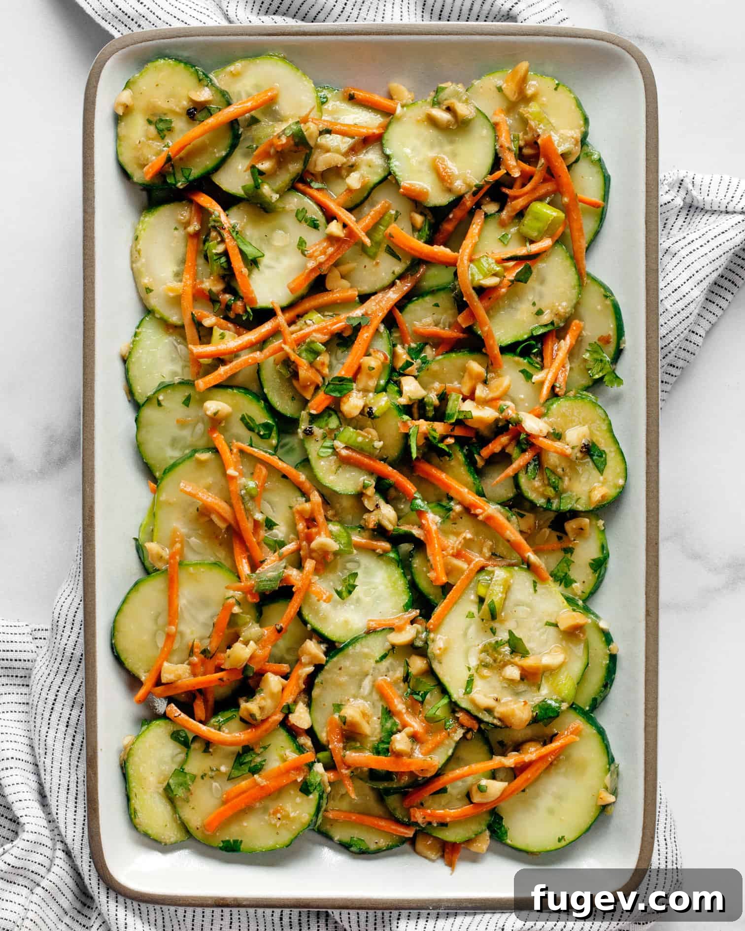 Close-up of a refreshing Cucumber Carrot Salad, showcasing the crisp texture and vibrant colors of the vegetables.