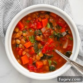 Bowl of green lentil soup with vibrant colors.