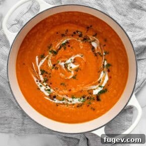 Creamy sweet potato soup in a rustic bowl.