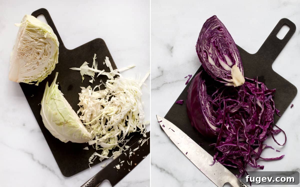 How to Shred Cabbage for Salad Shredded green and red cabbage on separate cutting boards, ready for the salad.
