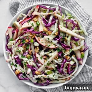 Apple cabbage salad elegantly served in a bowl.