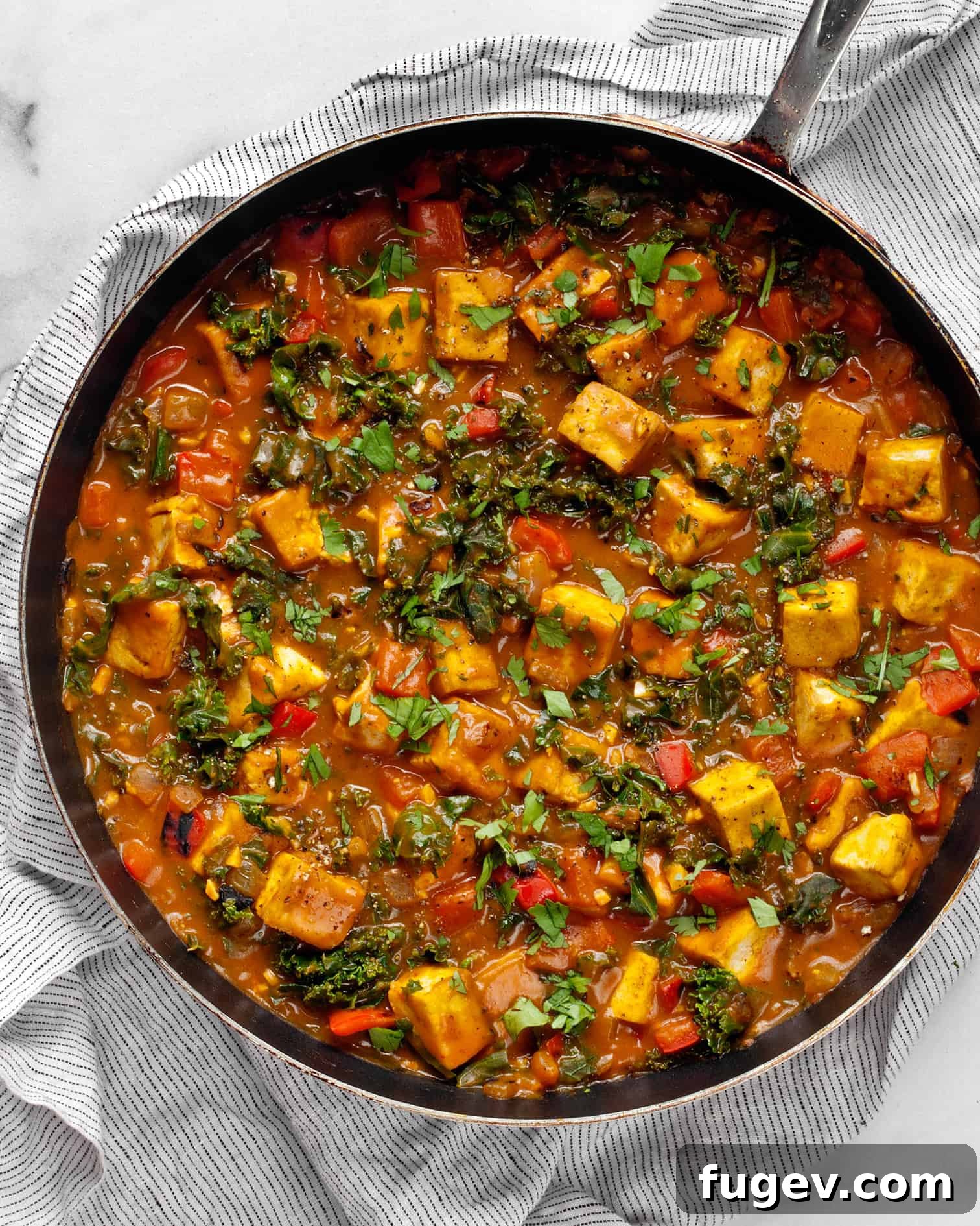 Golden Vegan Pumpkin Curry 2 Tofu Pumpkin Curry served in a bowl with rice