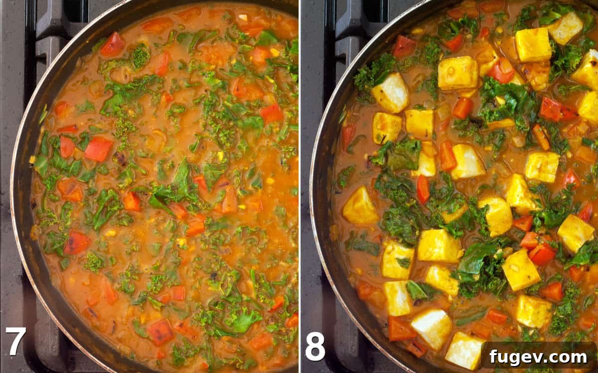 Golden Vegan Pumpkin Curry 7 Kale simmering in pumpkin puree and broth, with tofu being stirred in.
