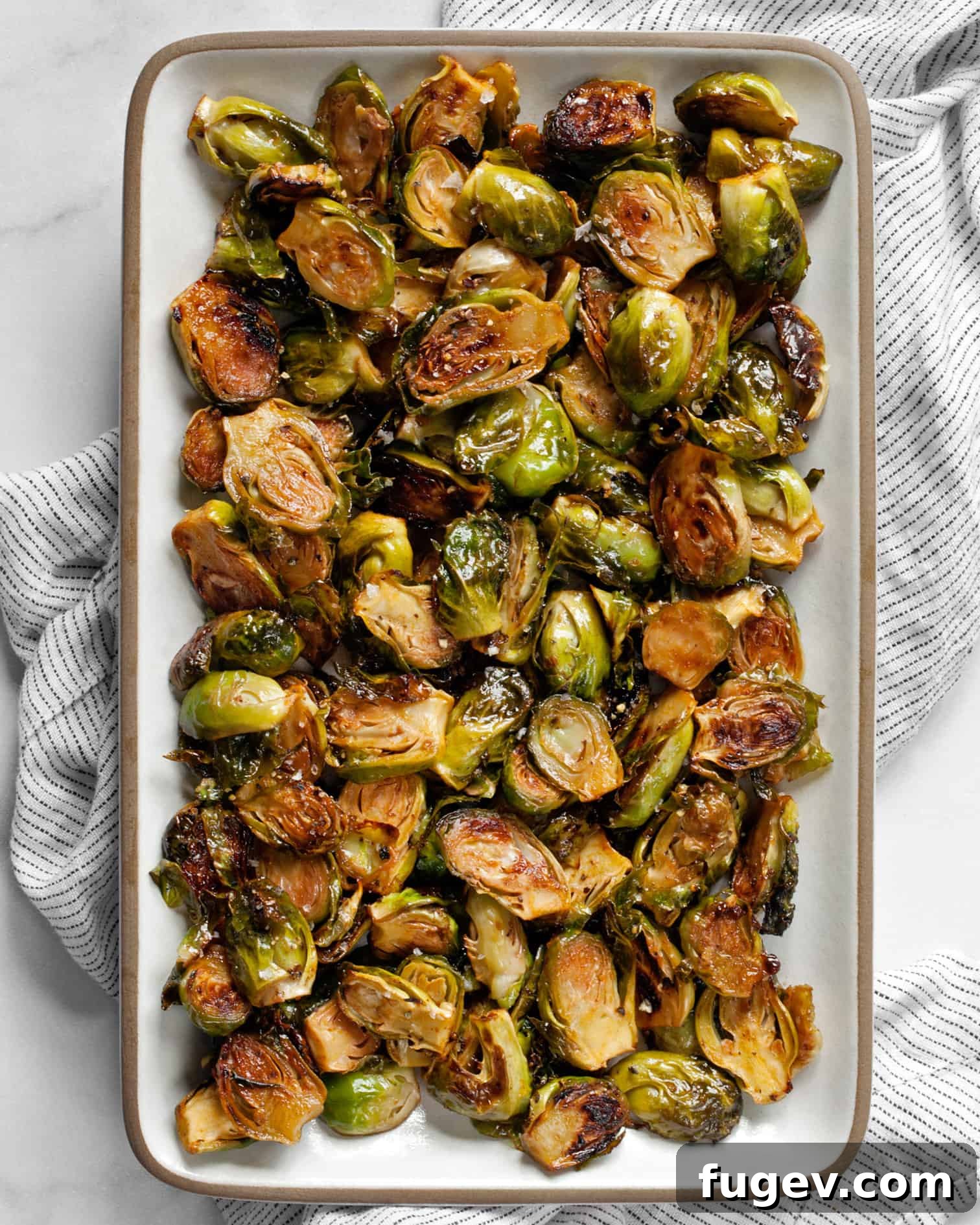 Sticky Sweet Heat Brussels Sprouts 3 Close-up of roasted Brussels sprouts coated in honey sriracha glaze
