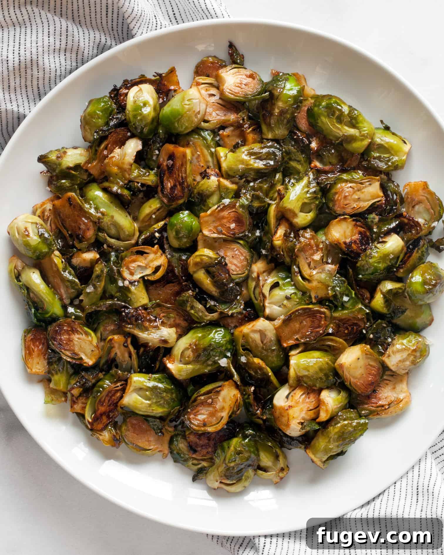 Sticky Sweet Heat Brussels Sprouts 8 Plated Honey Sriracha Roasted Brussels Sprouts, ready to be served