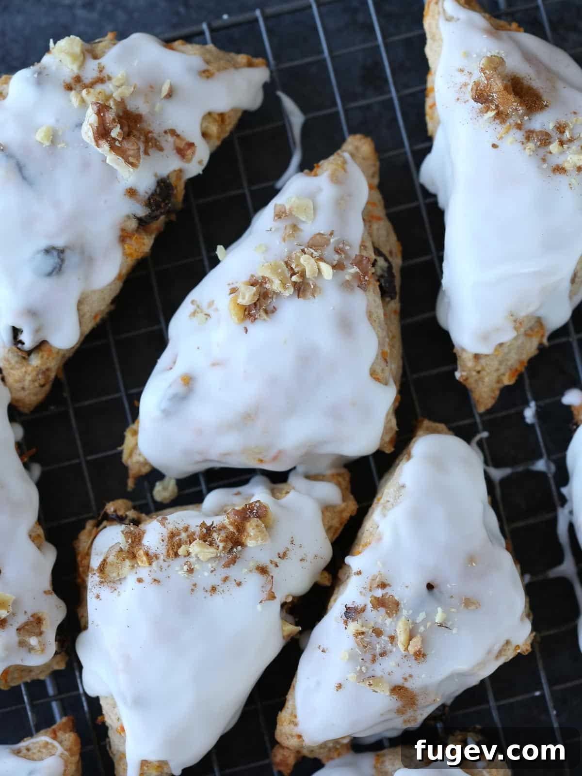 Spiced Carrot Scones 5 Carrot cake scones generously sprinkled with chopped walnuts on top of the glaze.