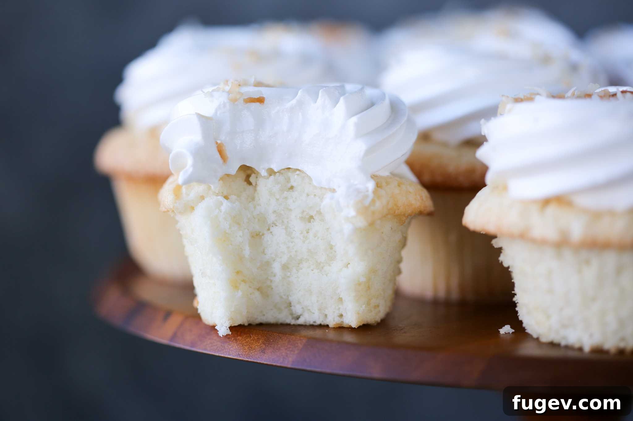 Tropical Coconut Delights 4 Sideview of Coconut Cupcakes with Fluffy White Frosting
