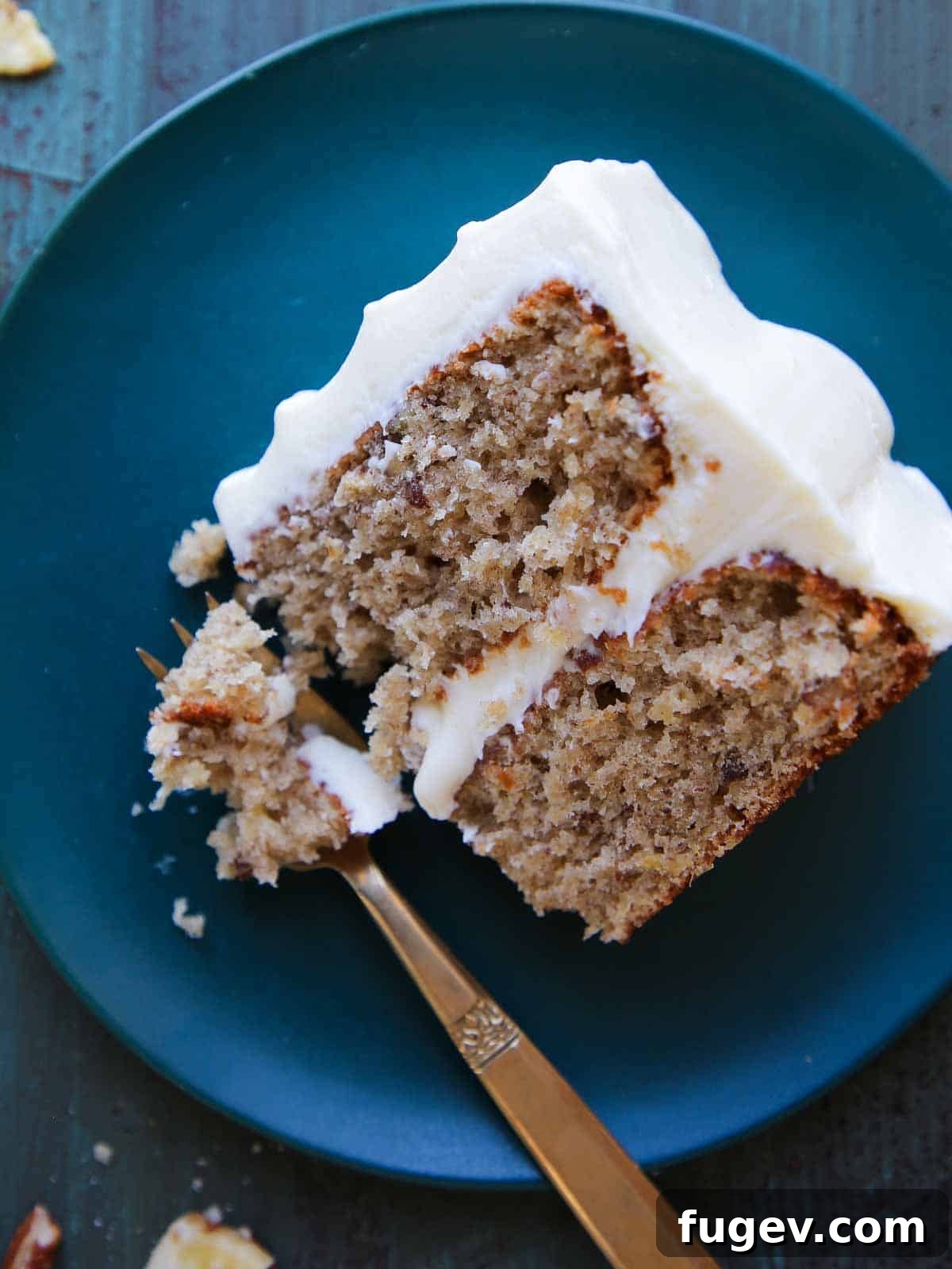 Sweet Nectar Delight 2 slice of hummingbird cake on teal plate.